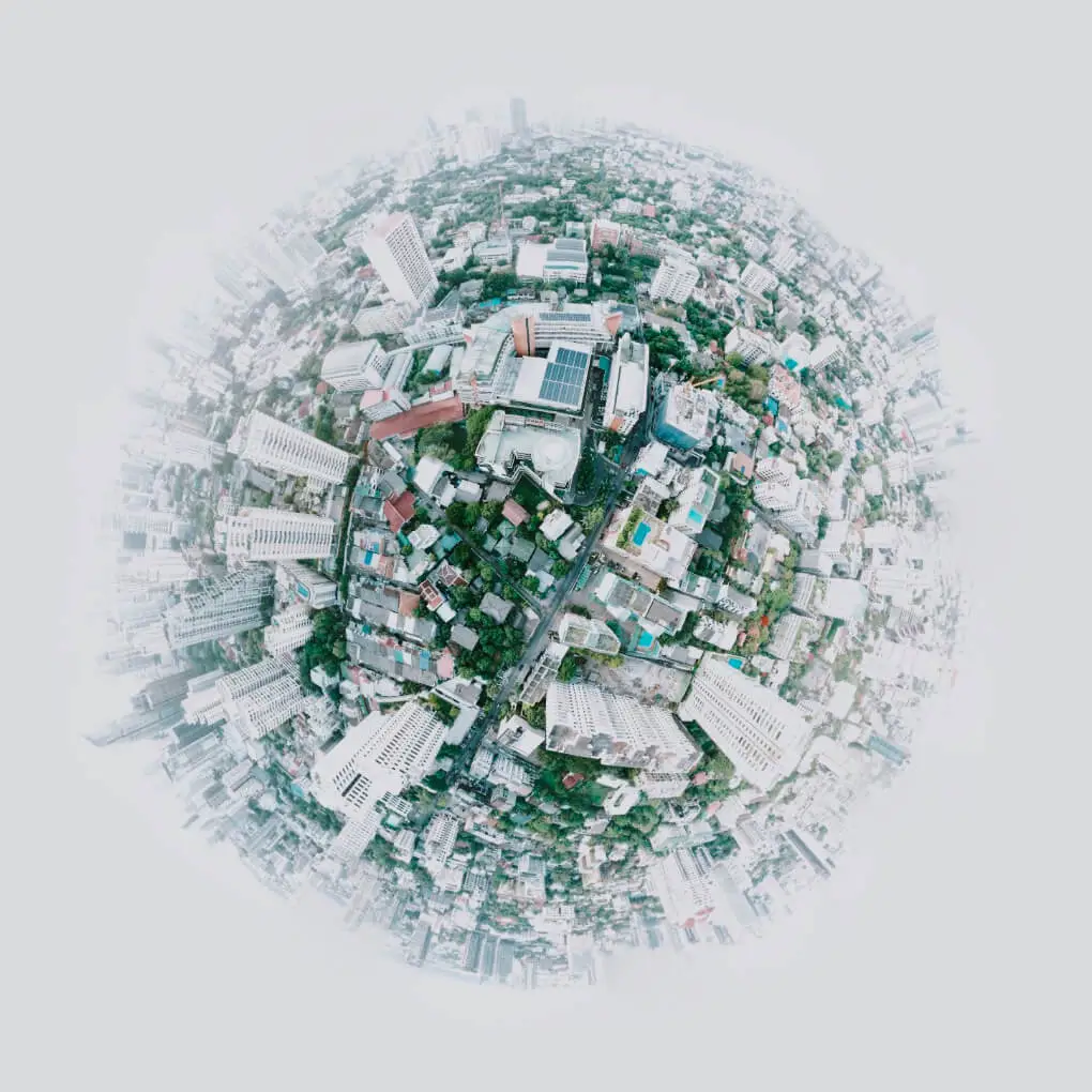 Cityscape in the shape of half globe, slowly rotating.